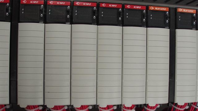 A PLC rack fully populated with add-on I/O cards.