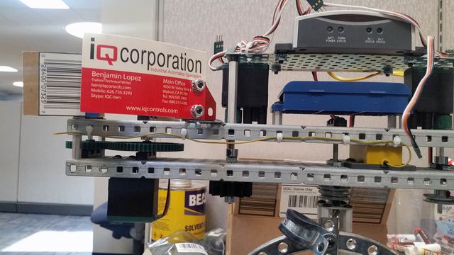 Barcode scanner verifying packaged snacks at a factory.