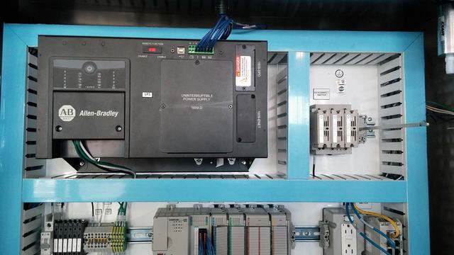 Panel with uninterruptible power supply battery backup and alert system.
